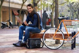 men-model-in-park-with-bike